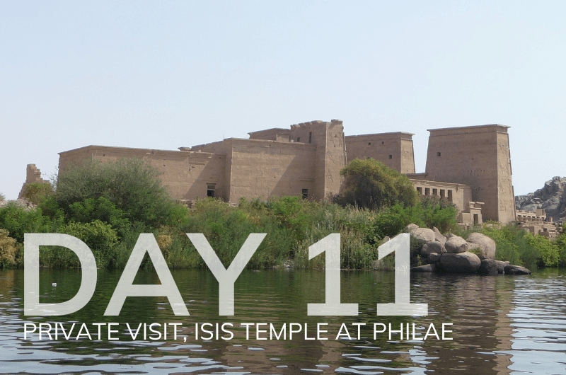 Isis Temple at Philae, ancient Egyptian architecture, lush greenery, serene water setting, day 11 of Sacred VIP Tour, private visit experience.