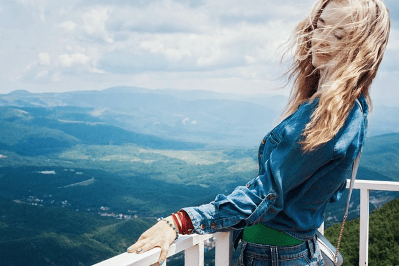 Blissful woman on a balcony