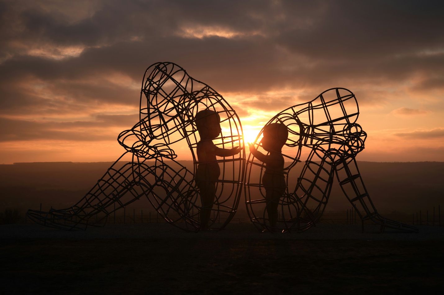 Burning Man sculpture at sunset