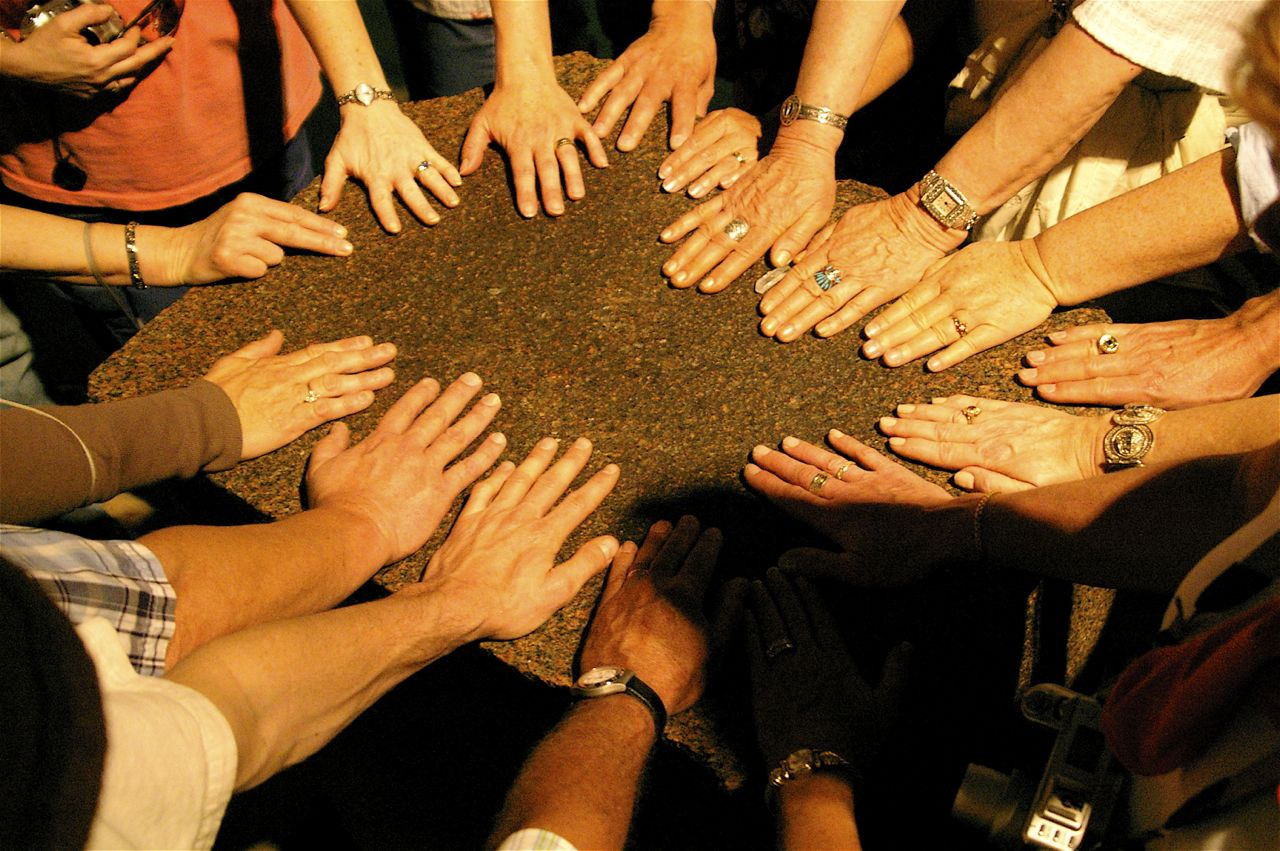 Group hands together in ceremony in Egypt