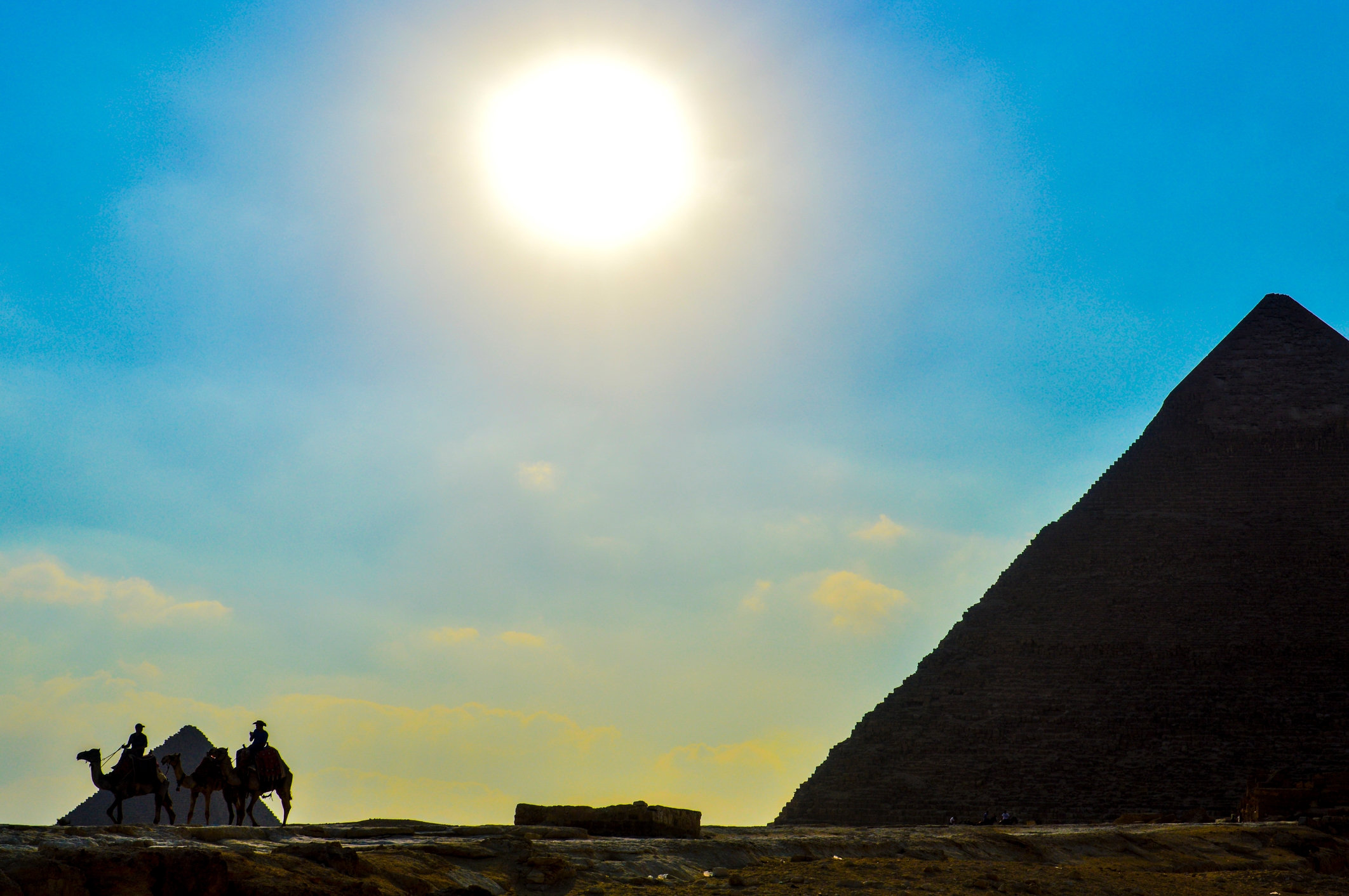 Beautiful bright sun over a pyramid in Egypt