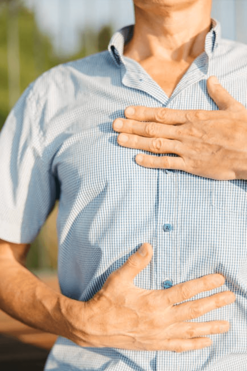 Man breathing with hands on chest and stomach