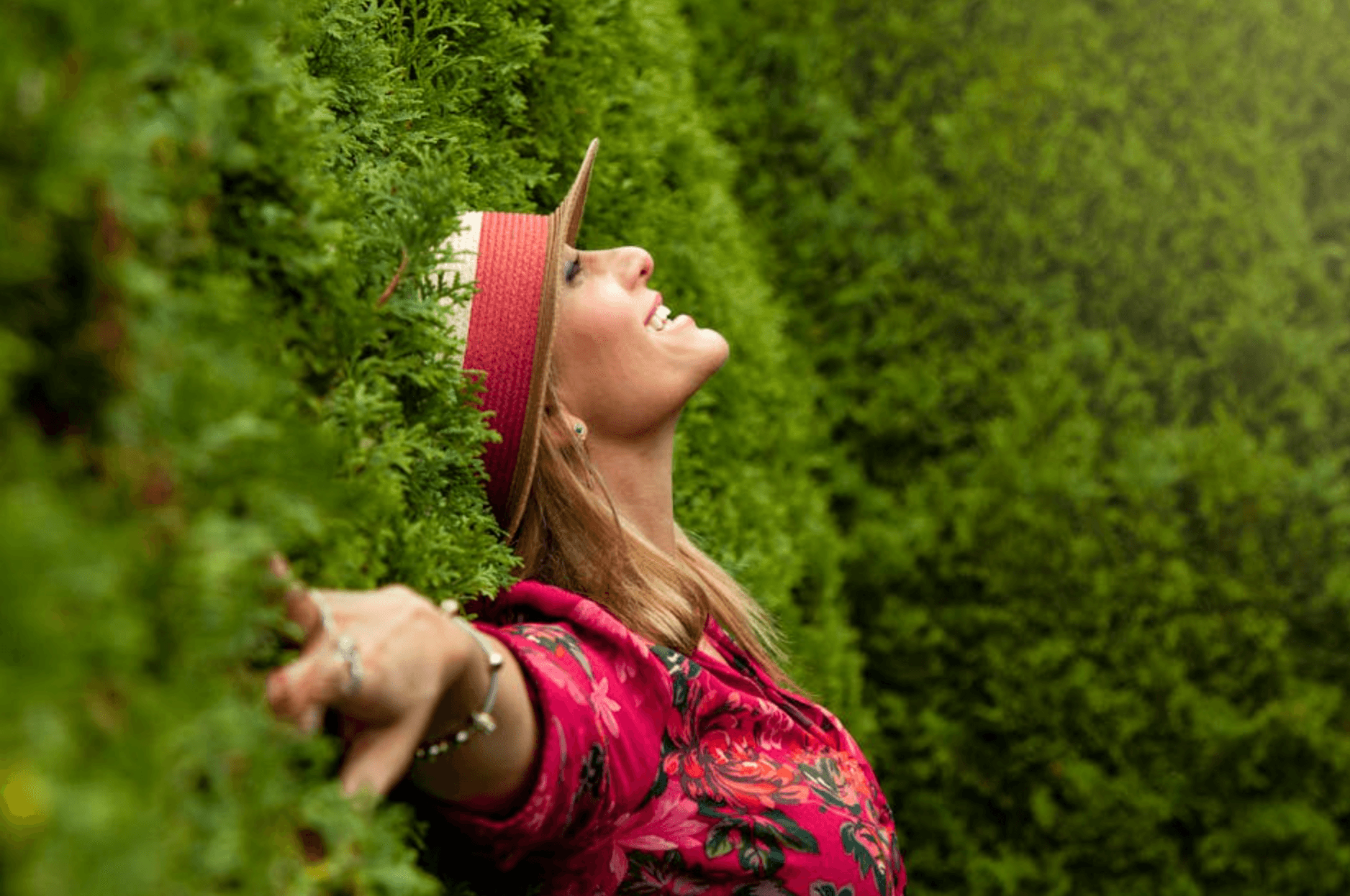 Happy woman lying in the grass