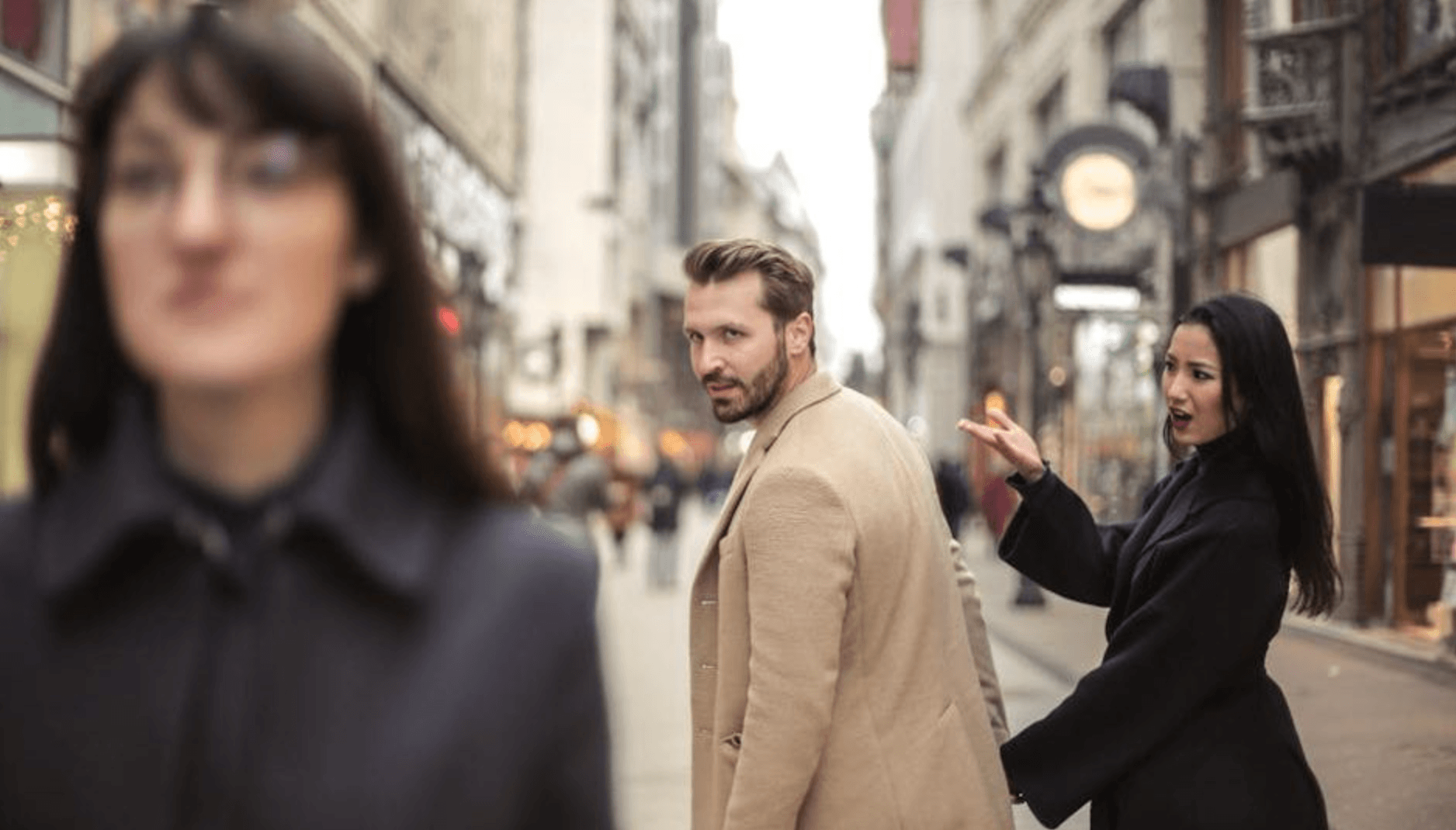 Man looking at another woman