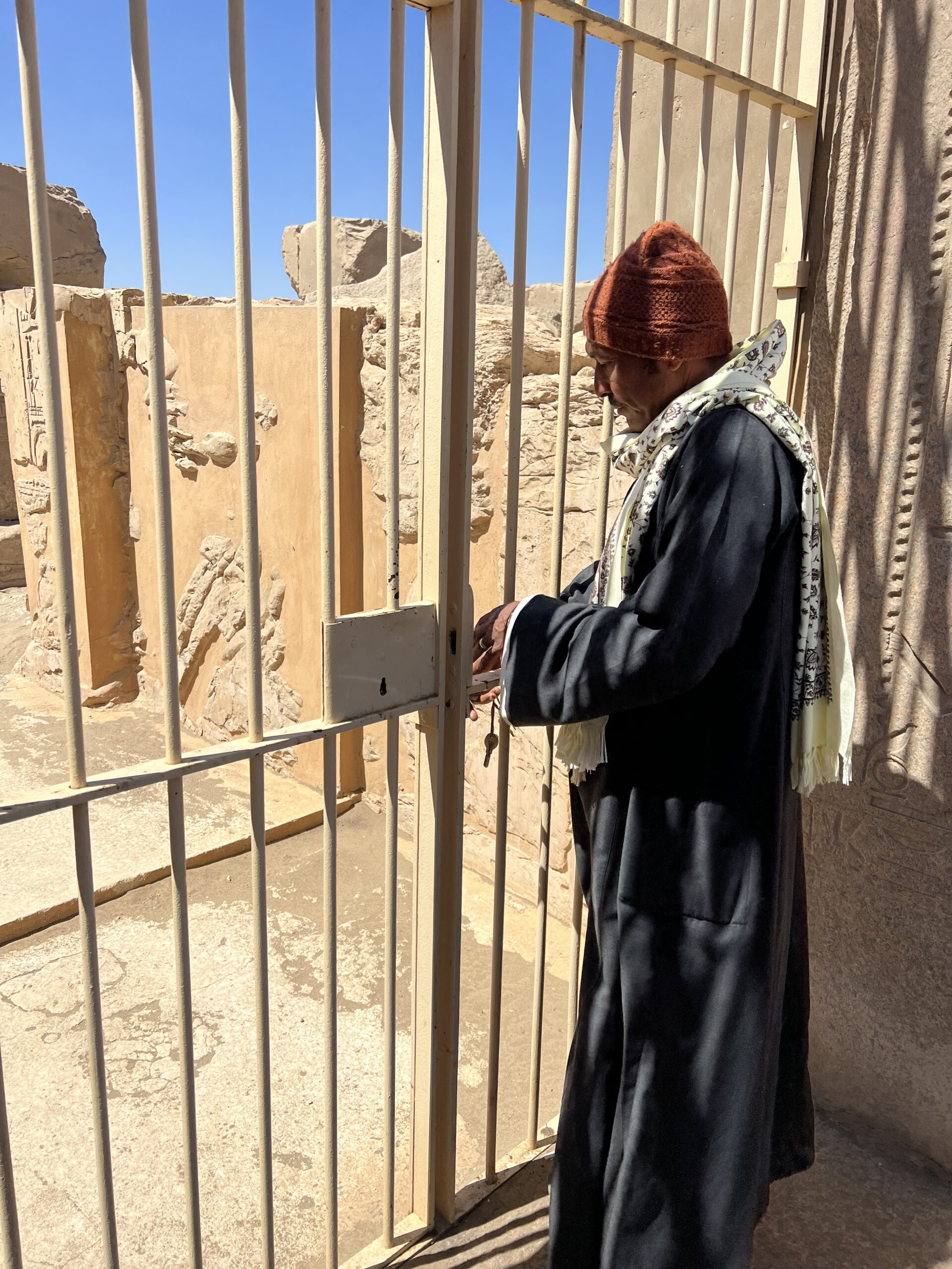 Man opening a gate in Egypt